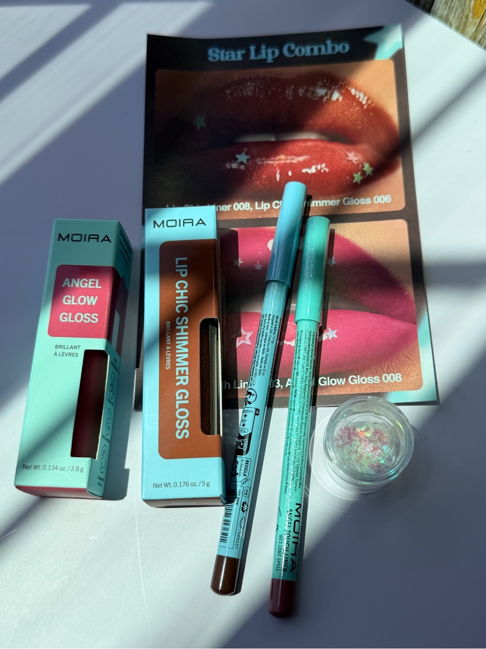 MOIRA Lip Chic Shimmer Gloss & Angel Glow Gloss Set - Teal Packaging